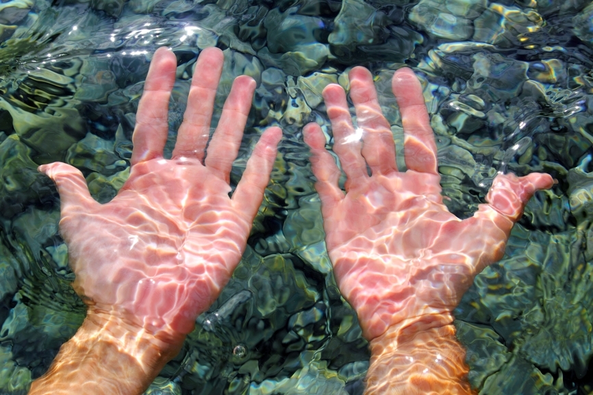 Hands in the ocean