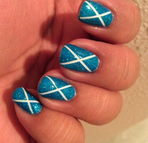 Sparkly cross blue nails Sparkly cross blue nails