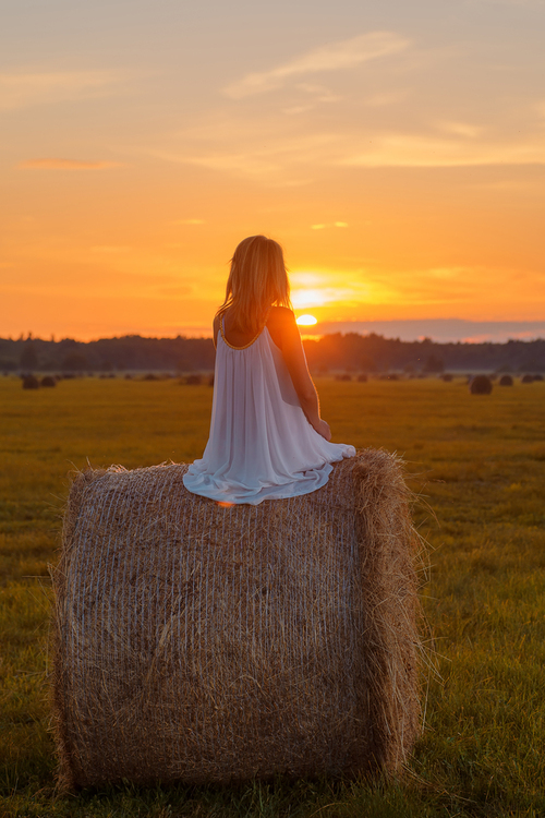 Sitting on a haybail