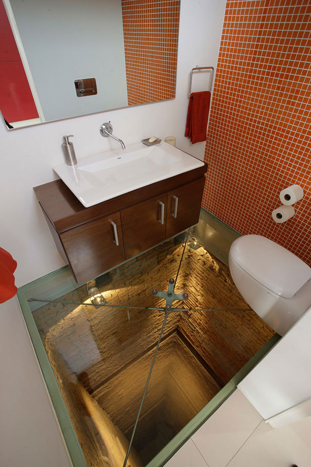 Glass floor and an open shaft
