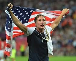 US Womans Team captain raises flag