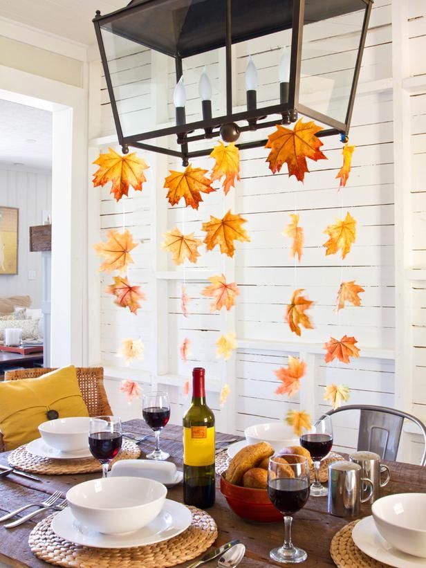Hang Leaf Streamers from Light Fixture over Thanksgiving Table