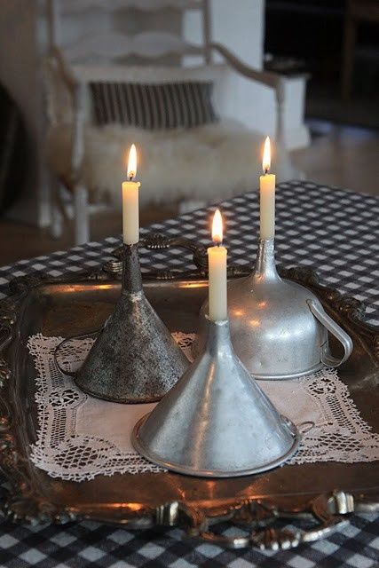 Old Metal Funnels used as Candle Holders Old Metal Funnels used as Candle Holders