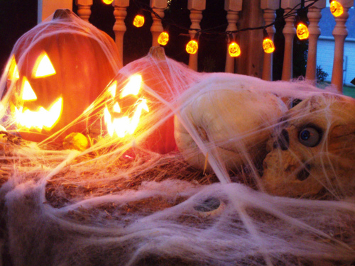 Skulls and pumpkins in cob webs