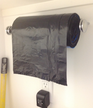 Paper towel holder for garbage bags