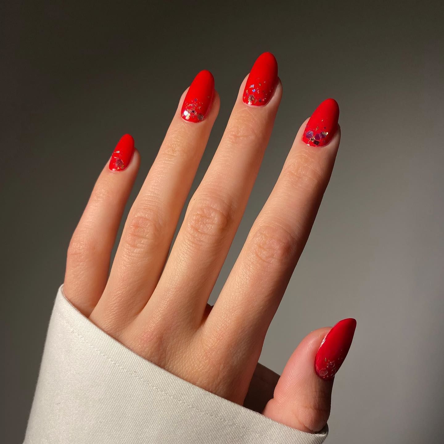 Elegant Red Matte Nails with Glitter Accents