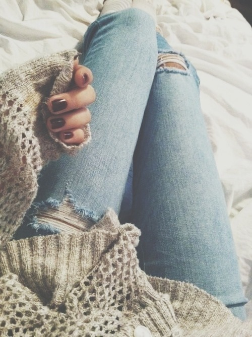 Torn jeans and warm sweater Torn jeans and warm sweater