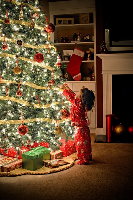 Child decorating the tree