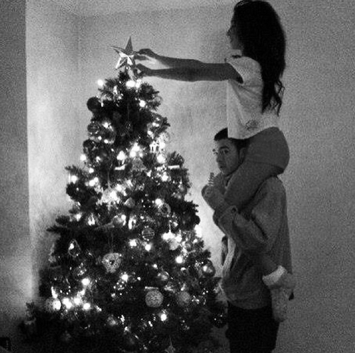 Couple decorating tree Couple decorating tree