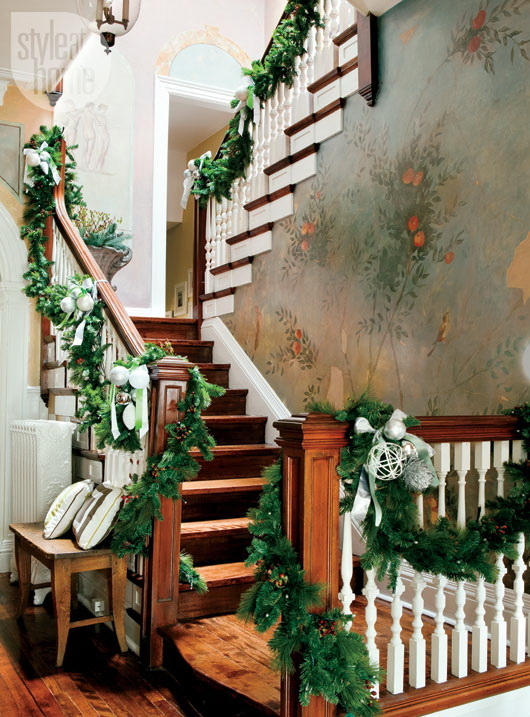 Evergreen wrapped around banister