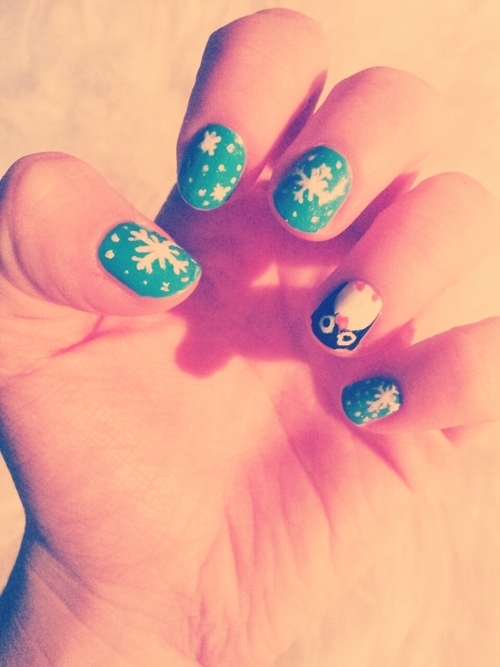 Snowflake and penguin nail art