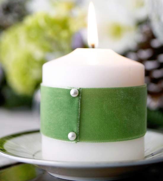 Green ribbon wrapped candle