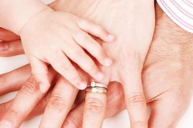Hands of family