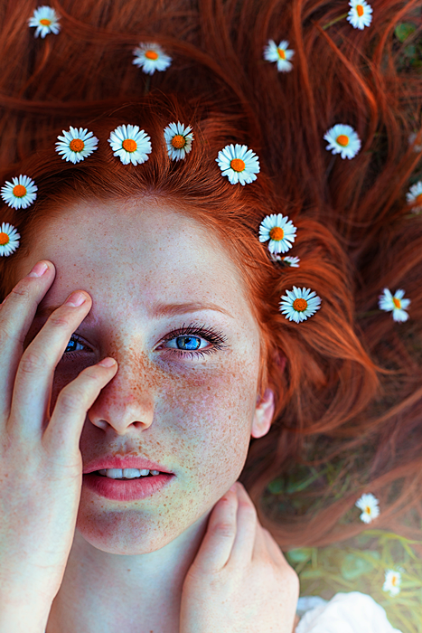 Freckled model with brunette floral hair Freckled model with brunette floral hair