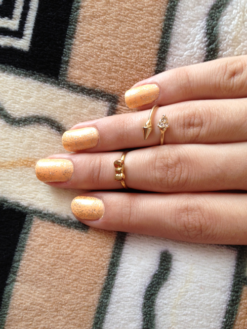 Gold sparkle nails and rings