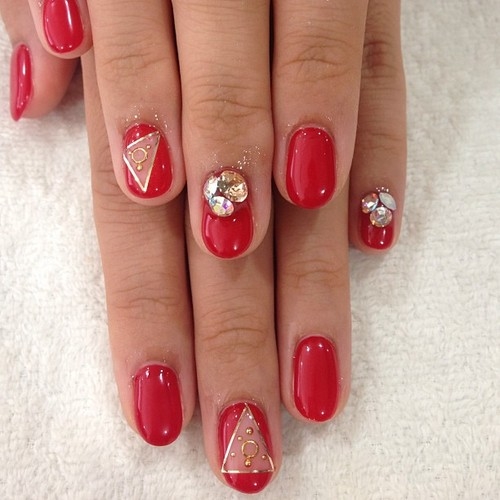 Red and gold designed nails