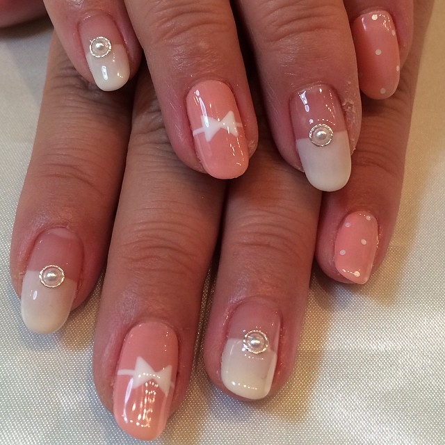 Pink bow and polkadot nails Pink bow and polkadot nails