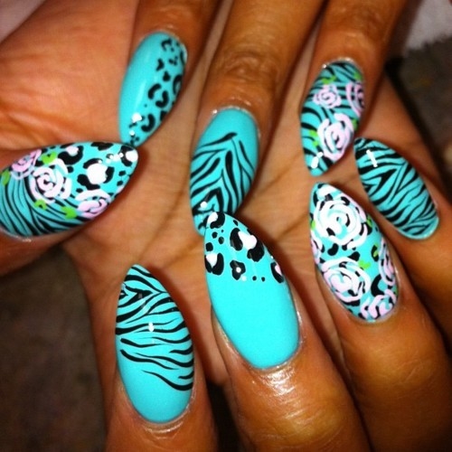 Animal print teal stiletto nails Animal print teal stiletto nails