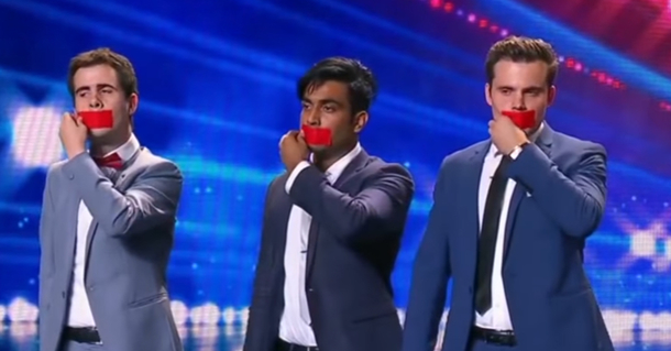 3 men walk on stage. As they peel off the tape from their faces, the audience and judges gasp in disbelief - picture 2