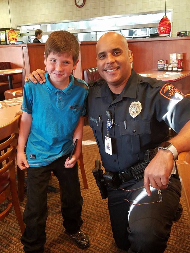 9-year-old boy hands cop a secret note. Reads the note and jumps out of his chair in shock. - picture 3