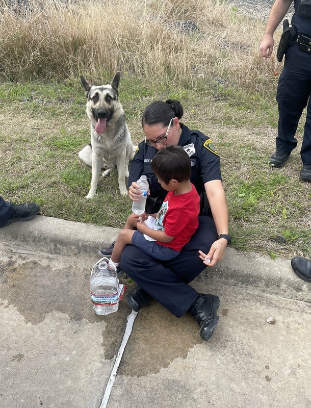 A missing 5-year-old boy with Down syndrome is found with his protective dog keeping him safe - picture 4