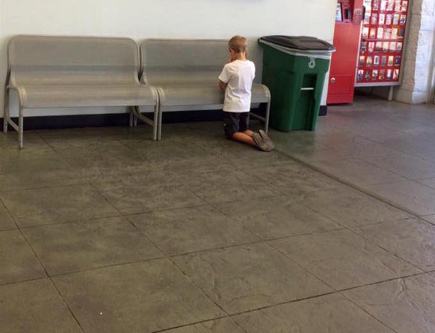 Boy Wanders Off While At Walmart With His Mother. Once Mom Finds Him Kneeling, She Looks At Blue Board Hung On Wall - picture 3