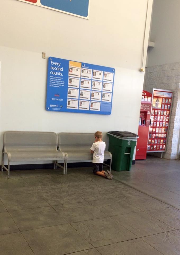 Boy Wanders Off While At Walmart With His Mother. Once Mom Finds Him Kneeling, She Looks At Blue Board Hung On Wall - picture 4