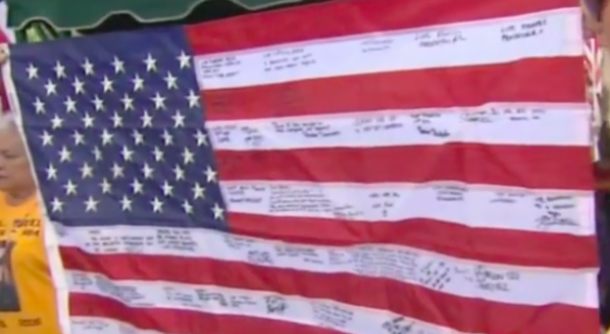 He Discovered This $5 Flag During A Garage Sale. When He Squints To Read The Writing, His Heart Drops - picture 6