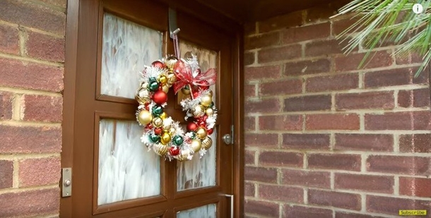 He Slips Ornaments Onto A Simple Wire Hanger To Create An Easy Christmas Wreath In A Snap - picture 3
