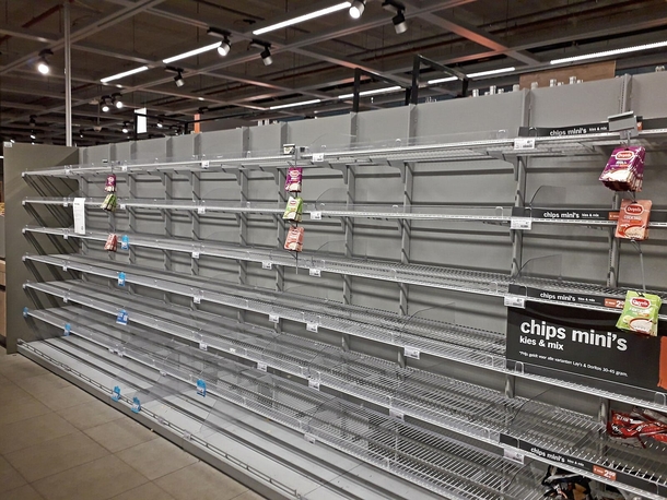 Heart-wrenching moment elderly woman looks at empty shelves inside of grocery store - picture 3