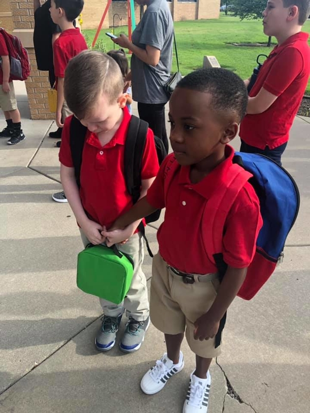 Little boy holds hand of crying friend with Autism so they won’t be scared at school - picture 2