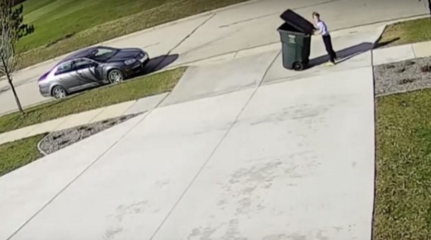Little Boy Pushes Trash To Curb, Quickly Finds Himself In Funny Incident That's Captured On Camera - picture 2