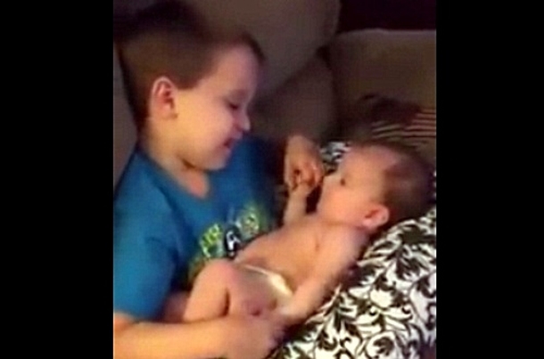 Mother catches her son holding his baby sister, what she hears him singing has this going viral! - picture 2