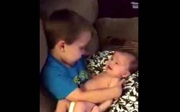 Mother catches her son holding his baby sister, what she hears him singing has this going viral! - picture 3