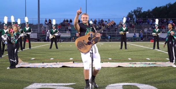 No One Stepped Forward To Sing The National Anthem, So He Removed His Helmet And Picked Up The Guitar - picture 2