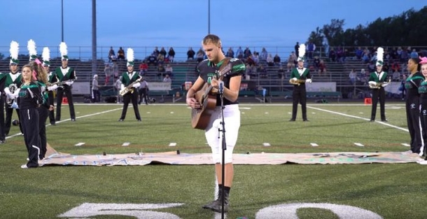 No One Stepped Forward To Sing The National Anthem, So He Removed His Helmet And Picked Up The Guitar - picture 4
