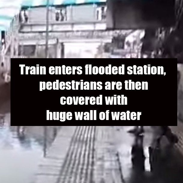 Train enters flooded station, pedestrians are then covered with huge wall of water