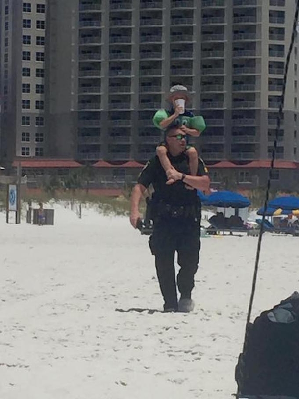 Woman Notices Cop Drenched In Sweat At The Beach, Can't Believe What's On His Back - picture 2