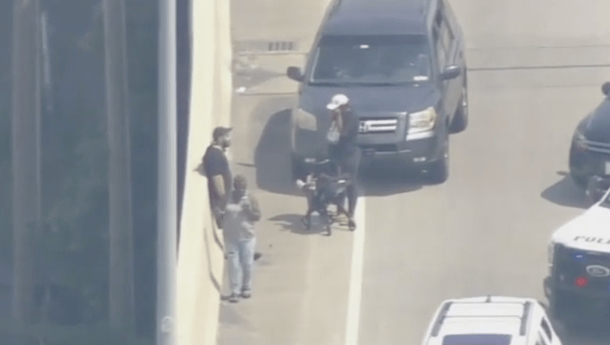 Woman spots man attempting to throw baby off an overpass and decides risk her life to intervene - picture 2