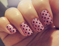 Pink nails with black polkadots