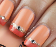 Orange jeweled nail art