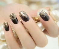Black nails with golden glitter