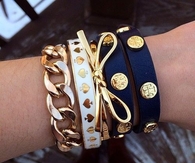 Gold, navy, and white bracelets