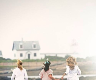 Friends running in sand