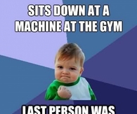 Sits down at a machine at the gym