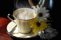 Steaming Cup of Coffee & Flowers