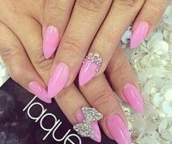 Pink stiletto bow nails
