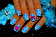 Blue polka dot nails with pink bows
