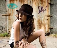 Woman with Arm and Calf Tattoos