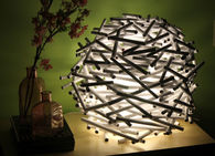 Rolled up newspaper lamp
